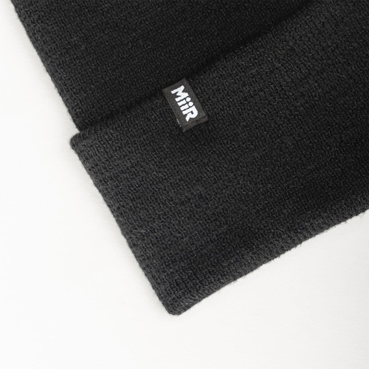 recycled-poly-fine-knit-beanie-t9 WebPDP-RecycledPolyFineKnitBeanie_Studio_TagDetail_Black__BNE005002OS.jpg