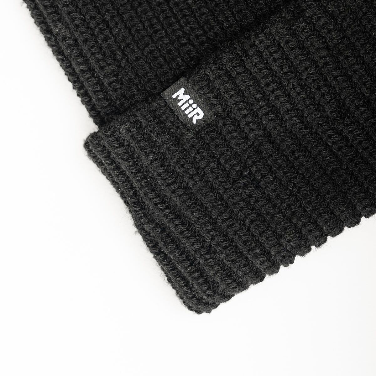 recycled-poly-rib-beanie-x4 WebPDP-RecycledPolyRibBeanie_Studio_TagDetail_Black__BNE002002OS.jpg